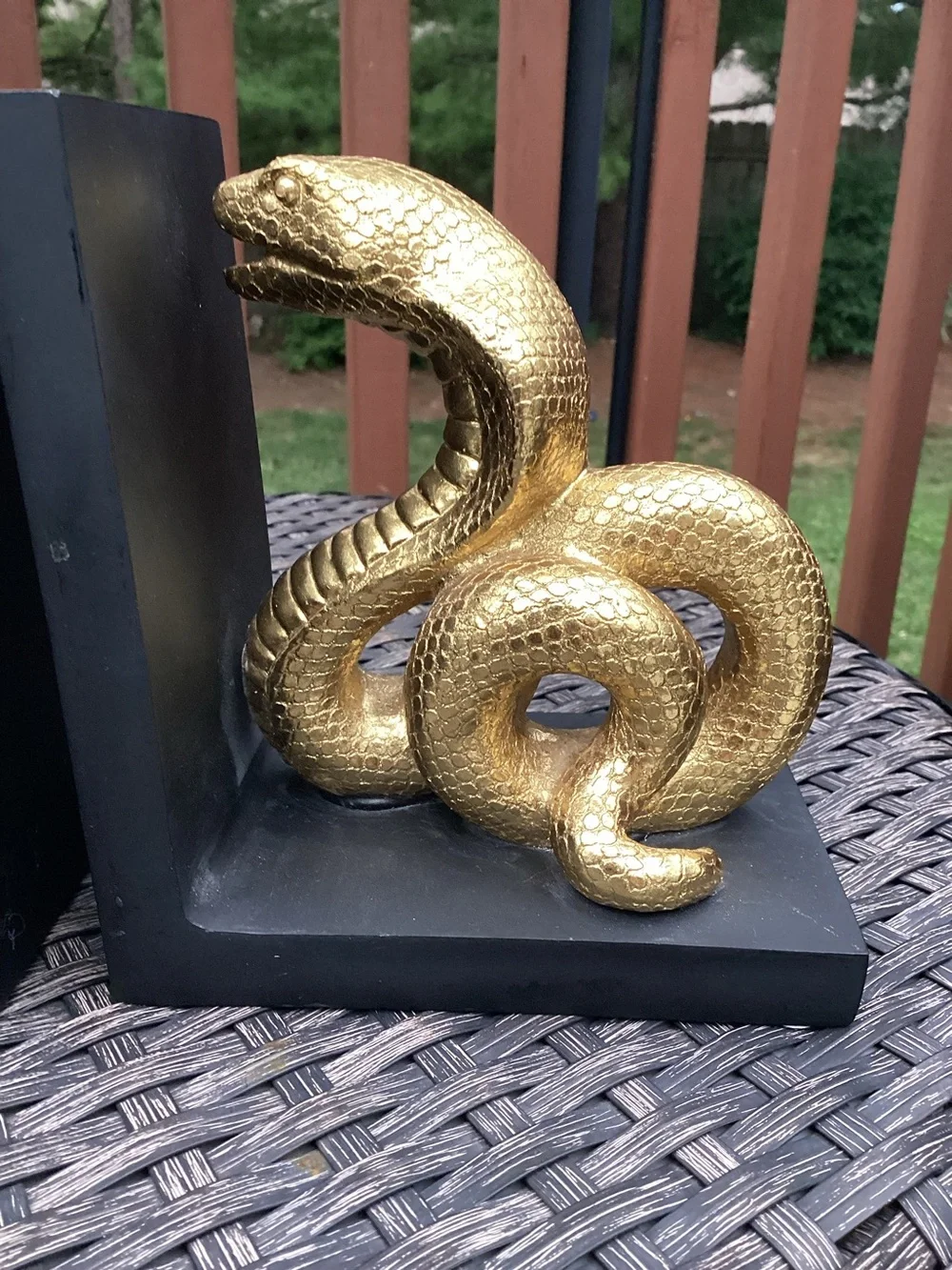 Cobra Snake Bookends, coiled snake motif in metallic gold on matte black stands
